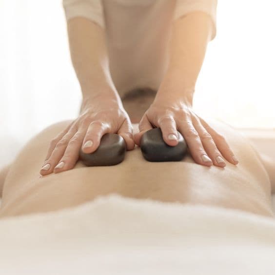 Combined oil and hot stone massage